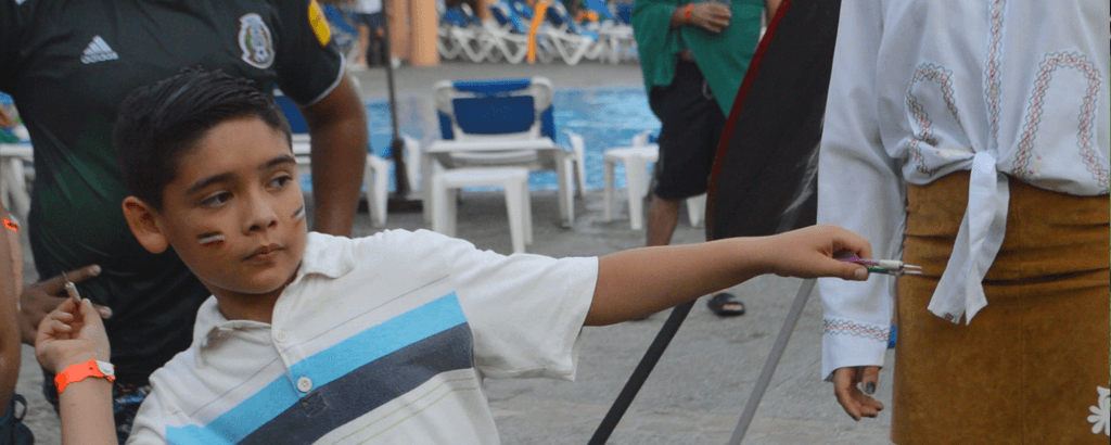 Playing Darts at Club Solaris Cabos